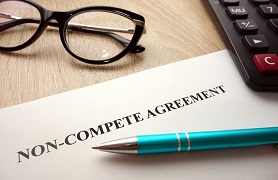 Agreement, pen and glases on table